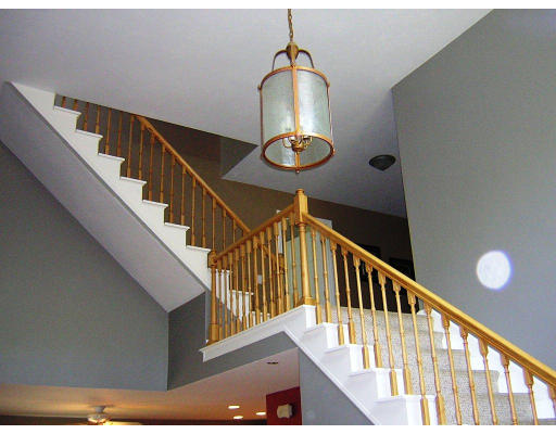 24 Sassawanna Road Rutland, MA 01543 - Photo 7 of 14 a view of staircase with railing and a chandelier