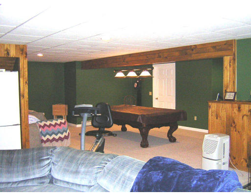 24 Sassawanna Road Rutland, MA 01543 - Photo 8 of 14 a room with furniture and wooden floor