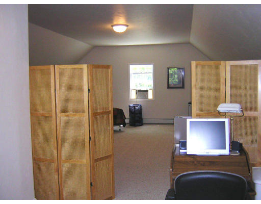 24 Sassawanna Road Rutland, MA 01543 - Photo 9 of 14 a bedroom with a bed and a lamp