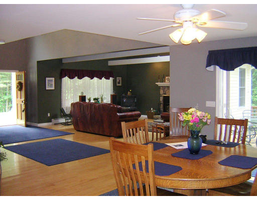 24 Sassawanna Road Rutland, MA 01543 - Photo 10 of 14 a living room with furniture and a chandelier