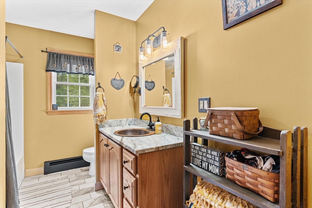4109 South Athol Road Athol, MA 01331 - Photo 14 of 38 a bathroom with a sink and a mirror