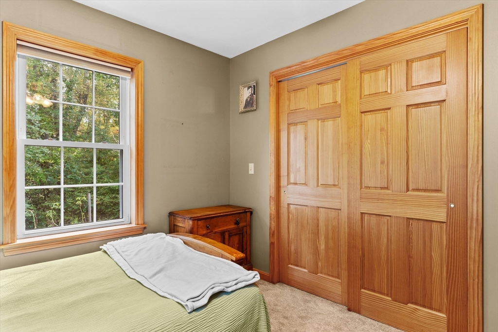 4109 South Athol Road Athol, MA 01331 - Photo 17 of 38 a bedroom with a bed and a window