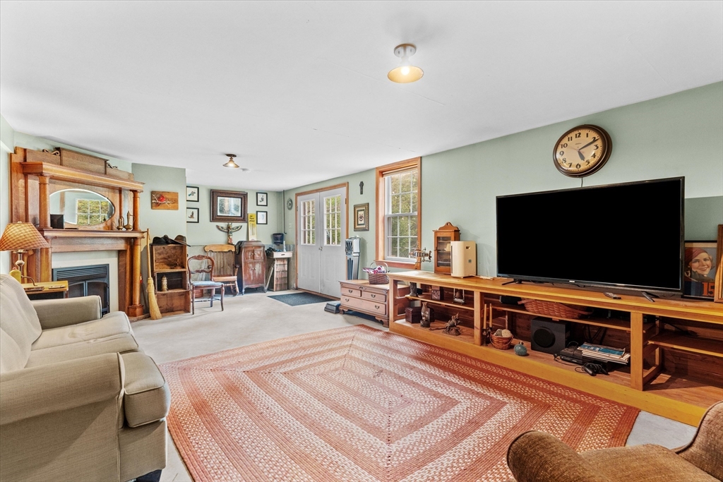 4109 South Athol Road Athol, MA 01331 - Photo 20 of 38 a living room with furniture and a flat screen tv