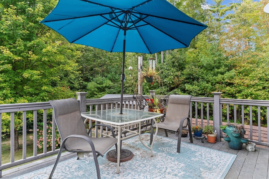 4109 South Athol Road Athol, MA 01331 - Photo 23 of 38 a view of a chair and table on the deck