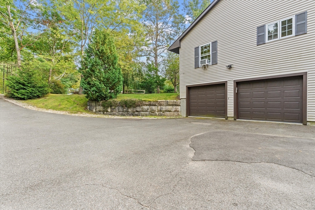 4109 South Athol Road Athol, MA 01331 - Photo 31 of 38 a view of a house with a yard and garage