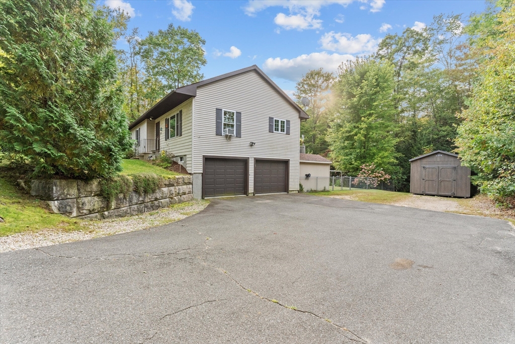 4109 South Athol Road Athol, MA 01331 - Photo 33 of 38 a view of a house with a yard and potted plants