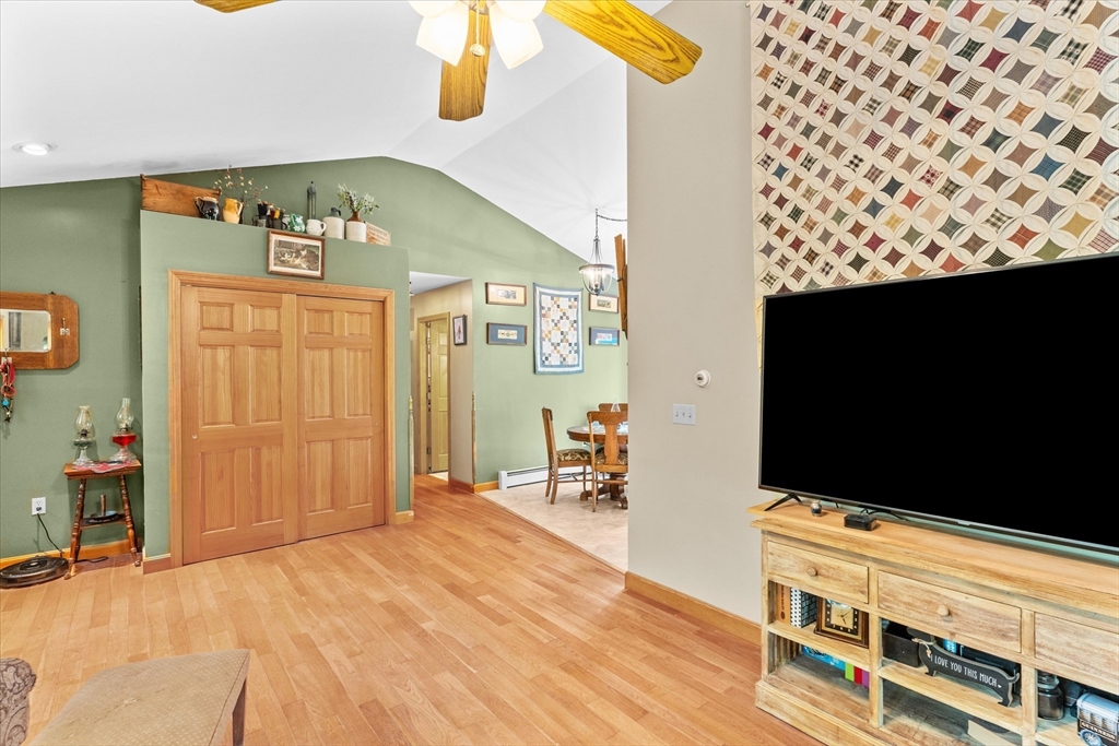 4109 South Athol Road Athol, MA 01331 - Photo 7 of 38 a bedroom with a bed and a flat tv screen on dresser