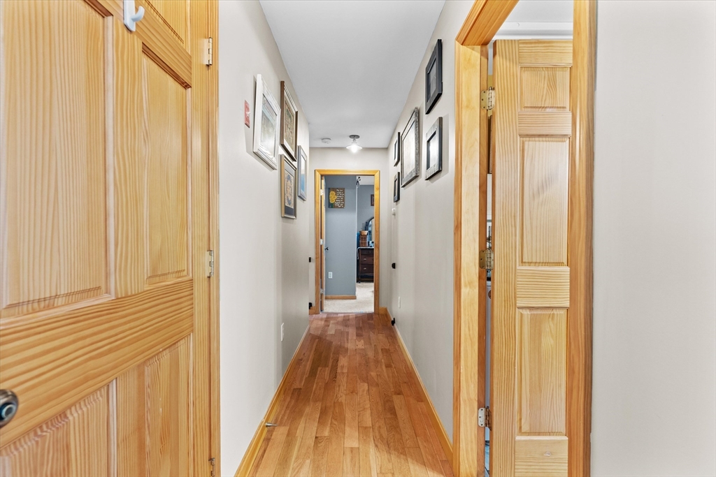 4109 South Athol Road Athol, MA 01331 - Photo 9 of 38 a view of a hallway with wooden floor and staircase