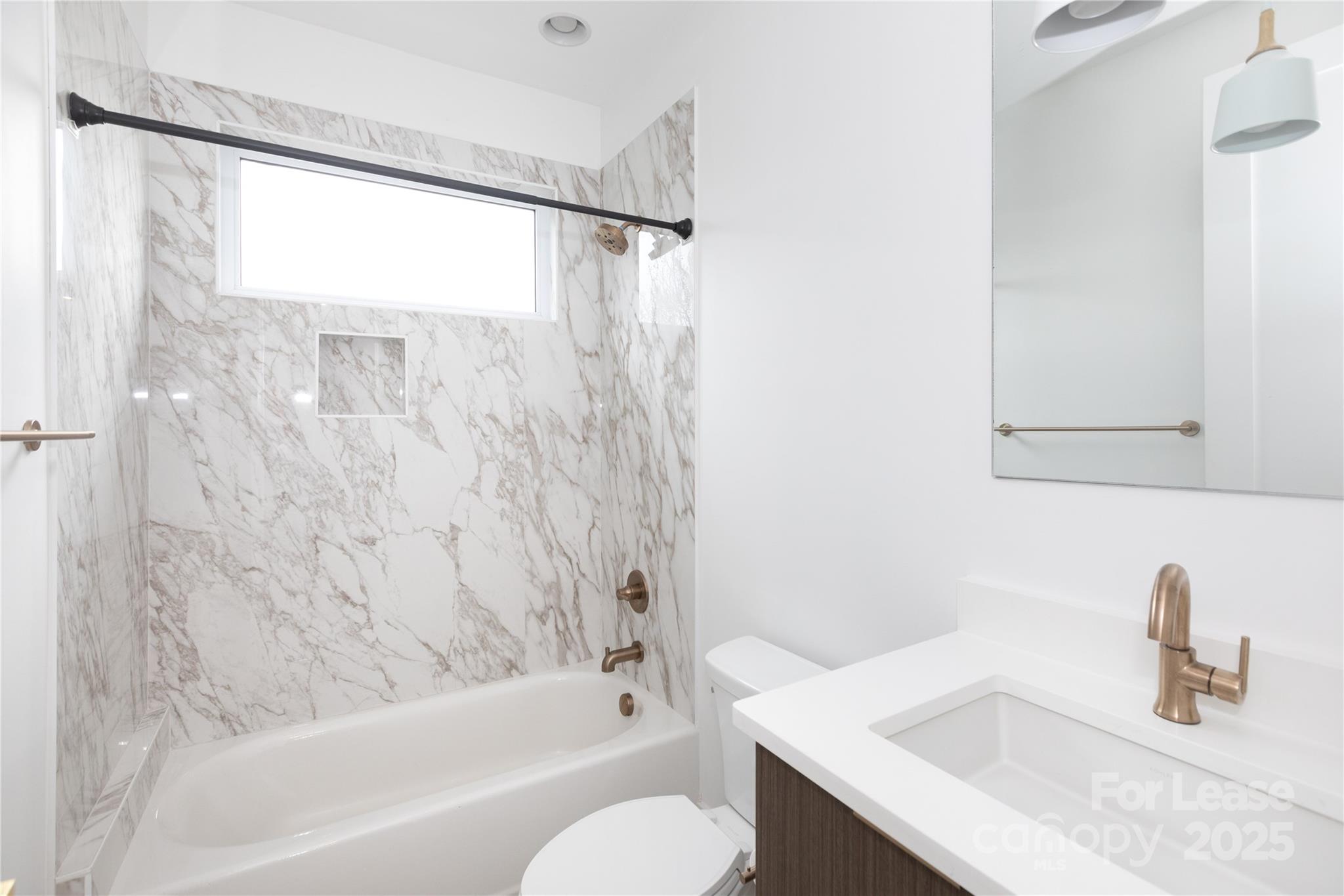 2649 Shenandoah Avenue Charlotte, NC 28205 - Photo 13 of 37 a bathroom with a sink and a bathtub