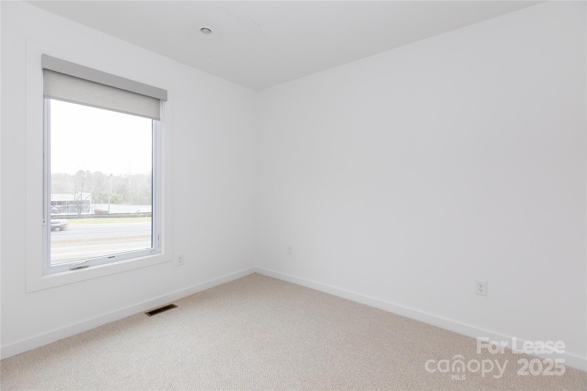 2649 Shenandoah Avenue Charlotte, NC 28205 - Photo 20 of 37 an empty room with a window