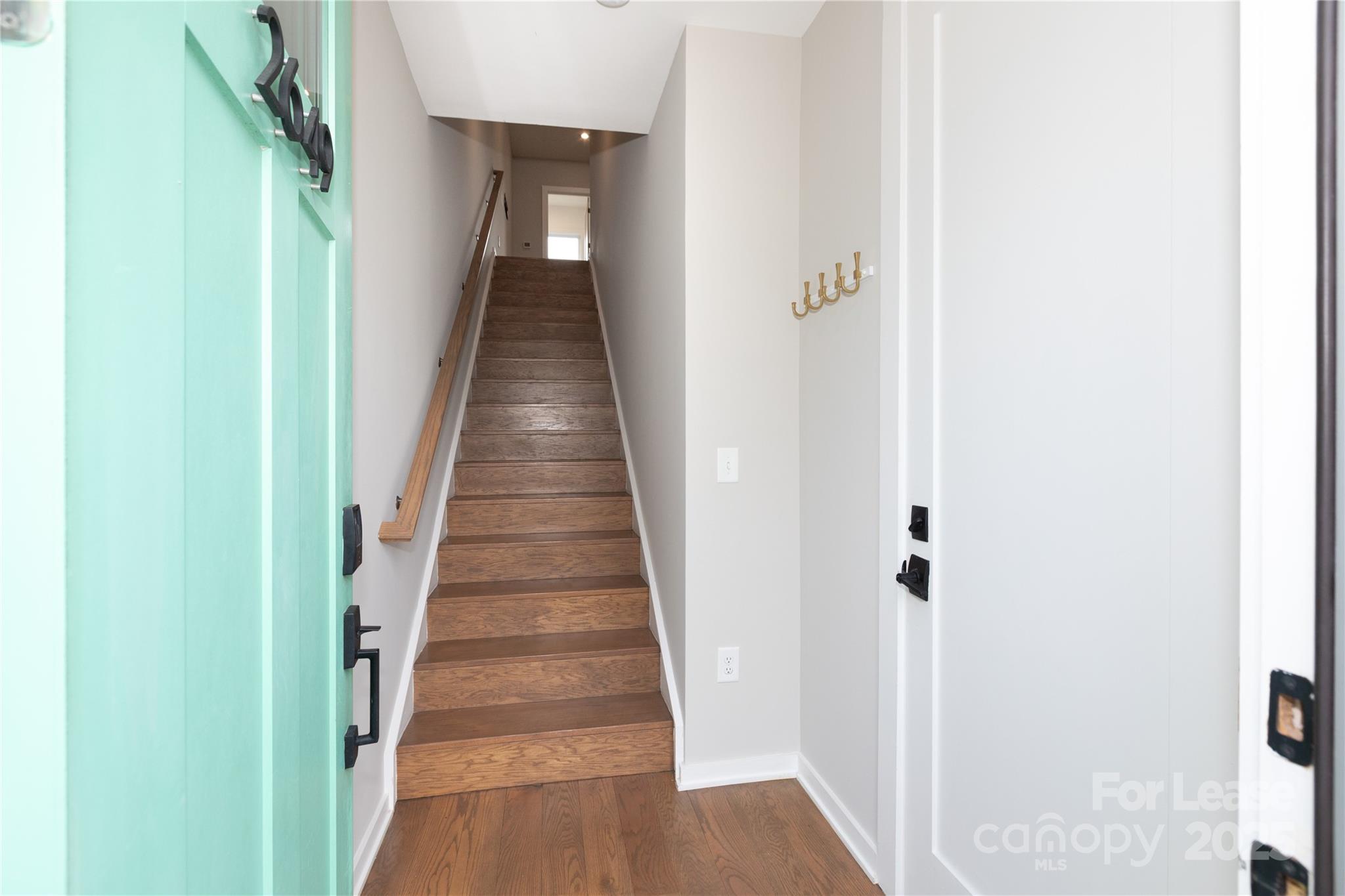 2649 Shenandoah Avenue Charlotte, NC 28205 - Photo 2 of 37 a view of a hallway with wooden floor and staircase