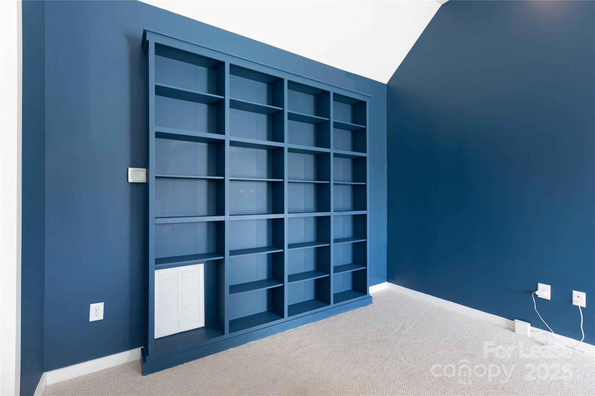 2649 Shenandoah Avenue Charlotte, NC 28205 - Photo 26 of 37 a view of a room with wooden floor and shelf