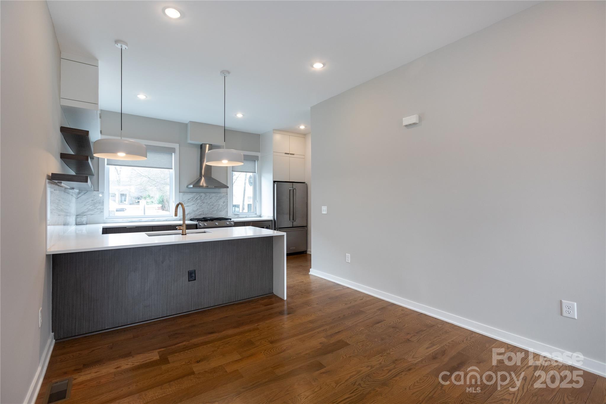 2649 Shenandoah Avenue Charlotte, NC 28205 - Photo 7 of 37 a large kitchen with granite countertop a large counter top and stainless steel appliances