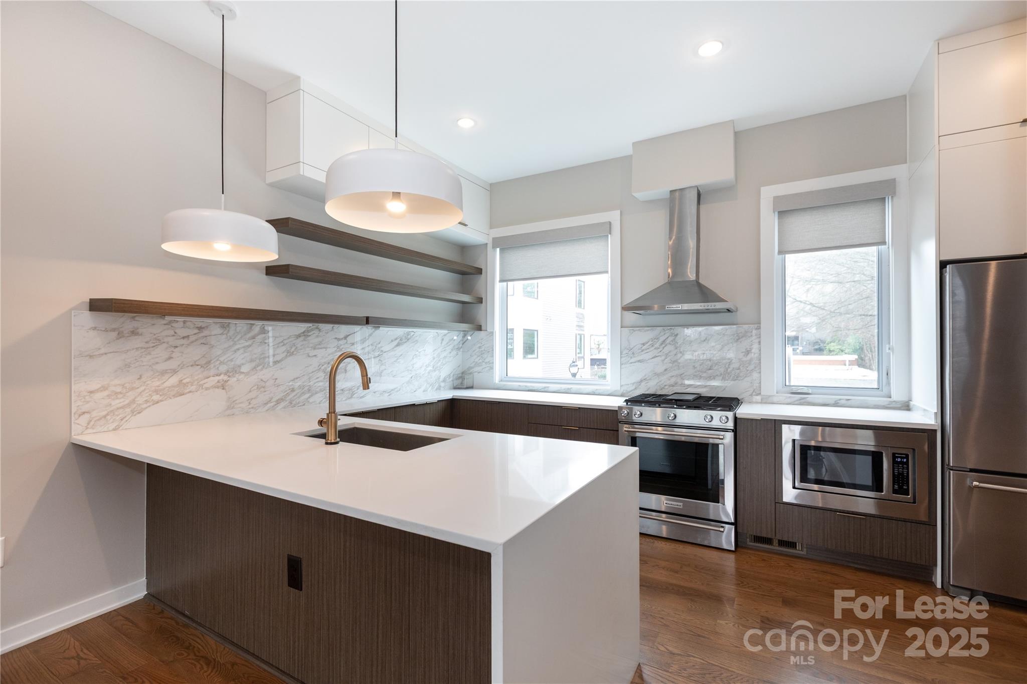 2649 Shenandoah Avenue Charlotte, NC 28205 - Photo 9 of 37 a kitchen with a sink a stove and cabinets