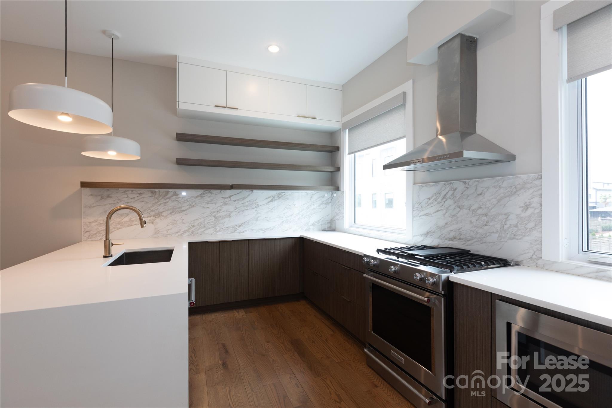 2649 Shenandoah Avenue Charlotte, NC 28205 - Photo 10 of 37 a kitchen with granite countertop a stove and a sink