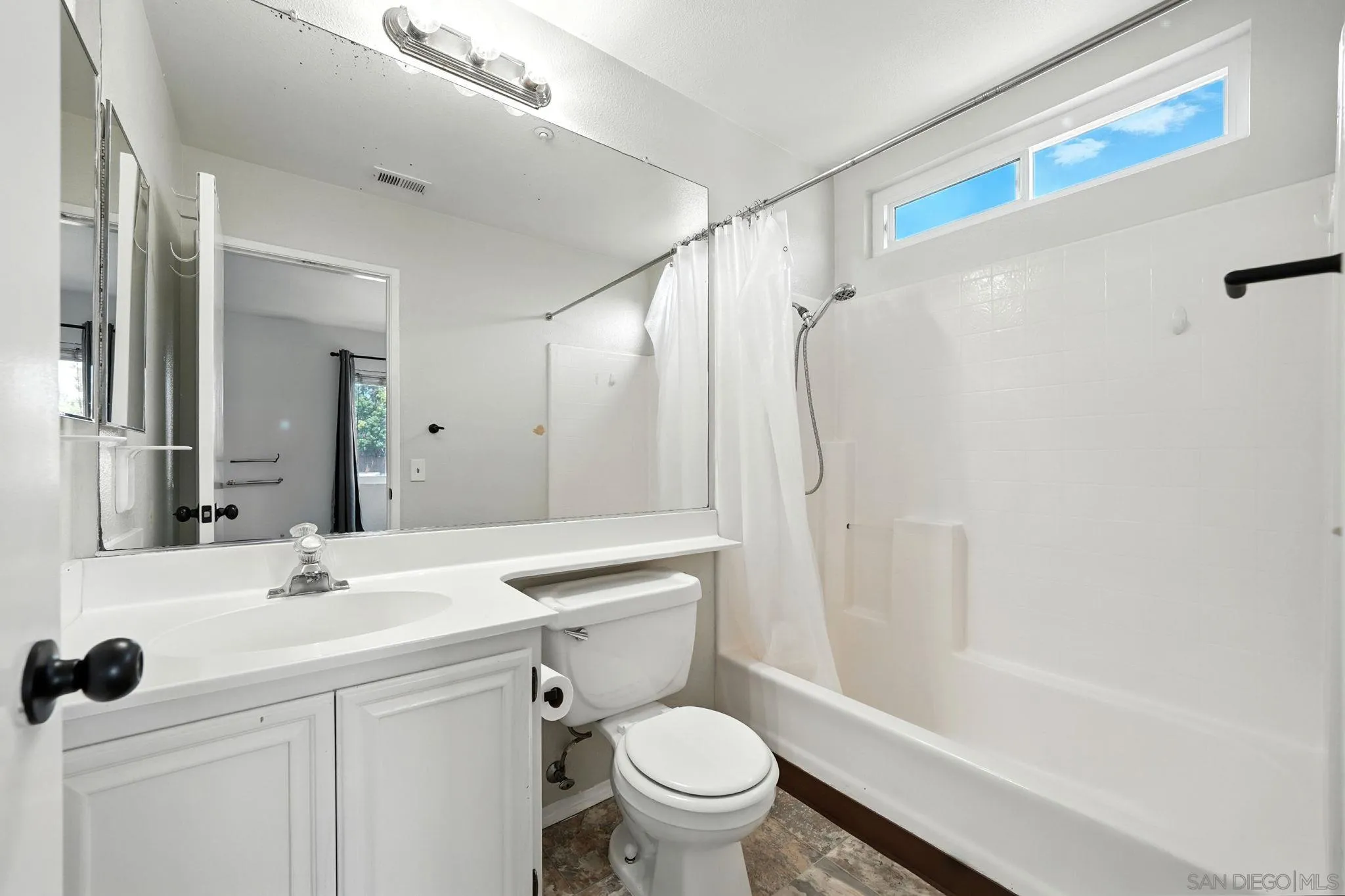 2256 Kings View Circle Spring Valley, CA 91977 - Photo 19 of 35 a bathroom with a sink toilet and shower