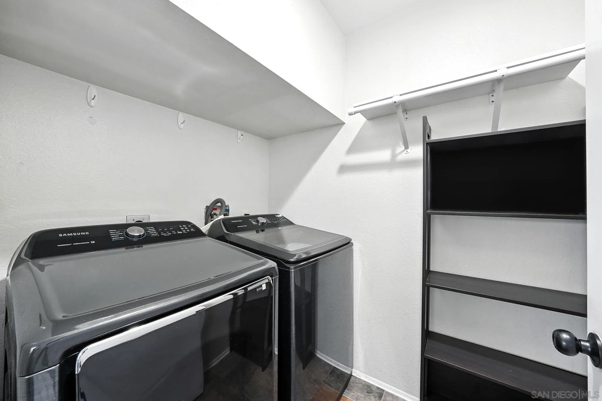 2256 Kings View Circle Spring Valley, CA 91977 - Photo 8 of 35 a utility room with dryer and washer