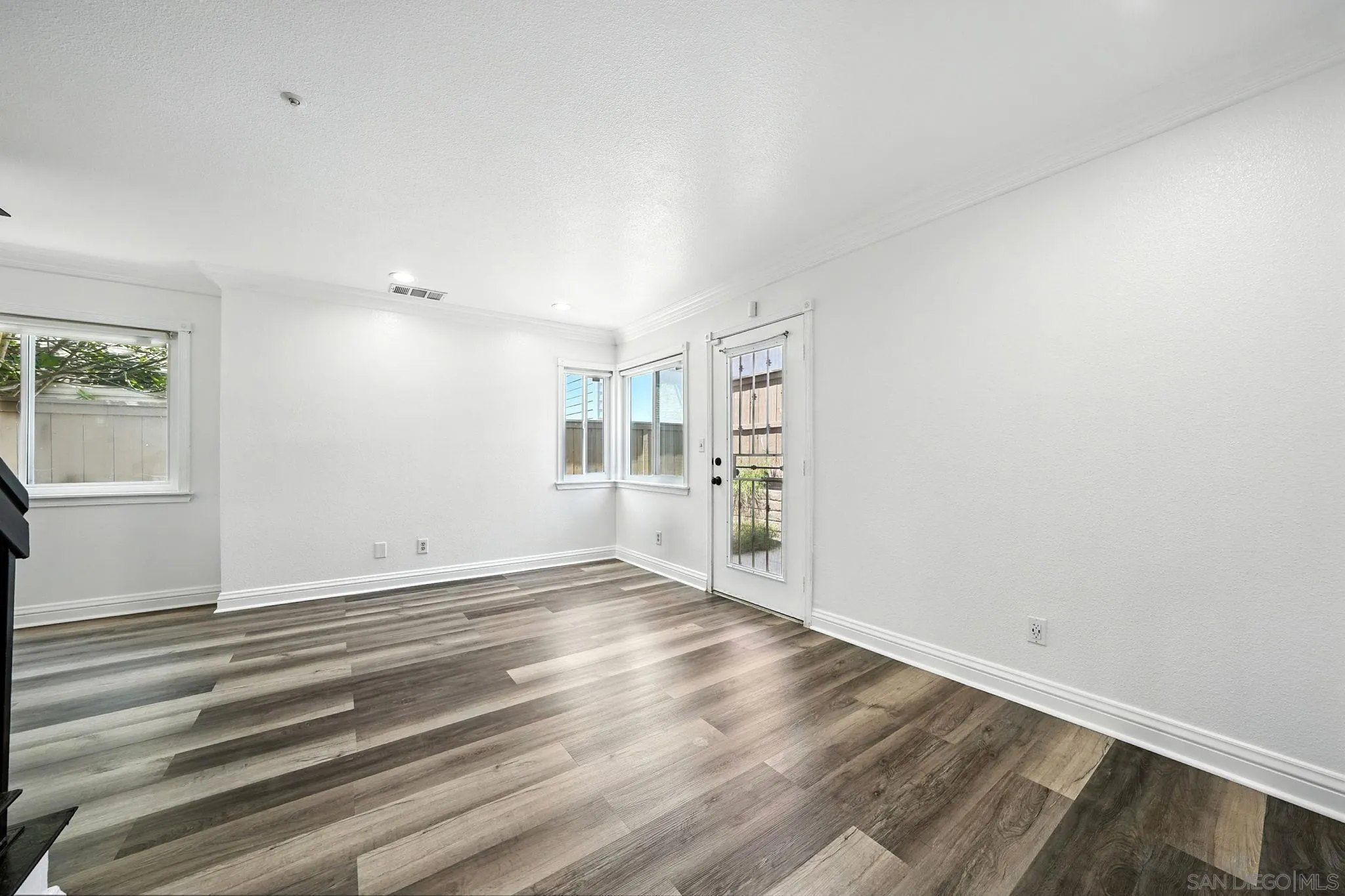 2256 Kings View Circle Spring Valley, CA 91977 - Photo 9 of 35 a view of empty room with wooden floor and window