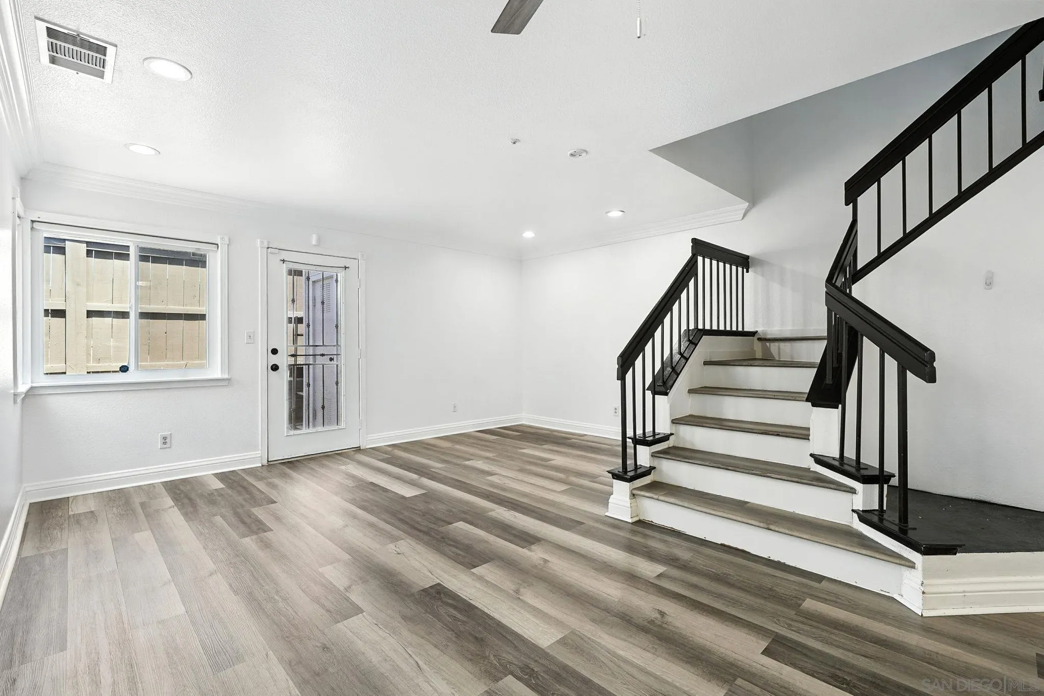 2256 Kings View Circle Spring Valley, CA 91977 - Photo 10 of 35 a view of entryway with wooden floor and stairs