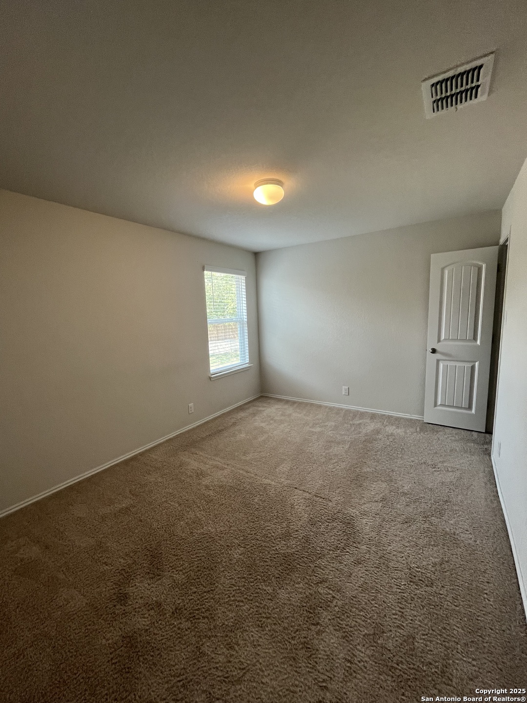 6218 Tadpole Bluff Converse, TX 78109 - Photo 13 of 23 an empty room with windows