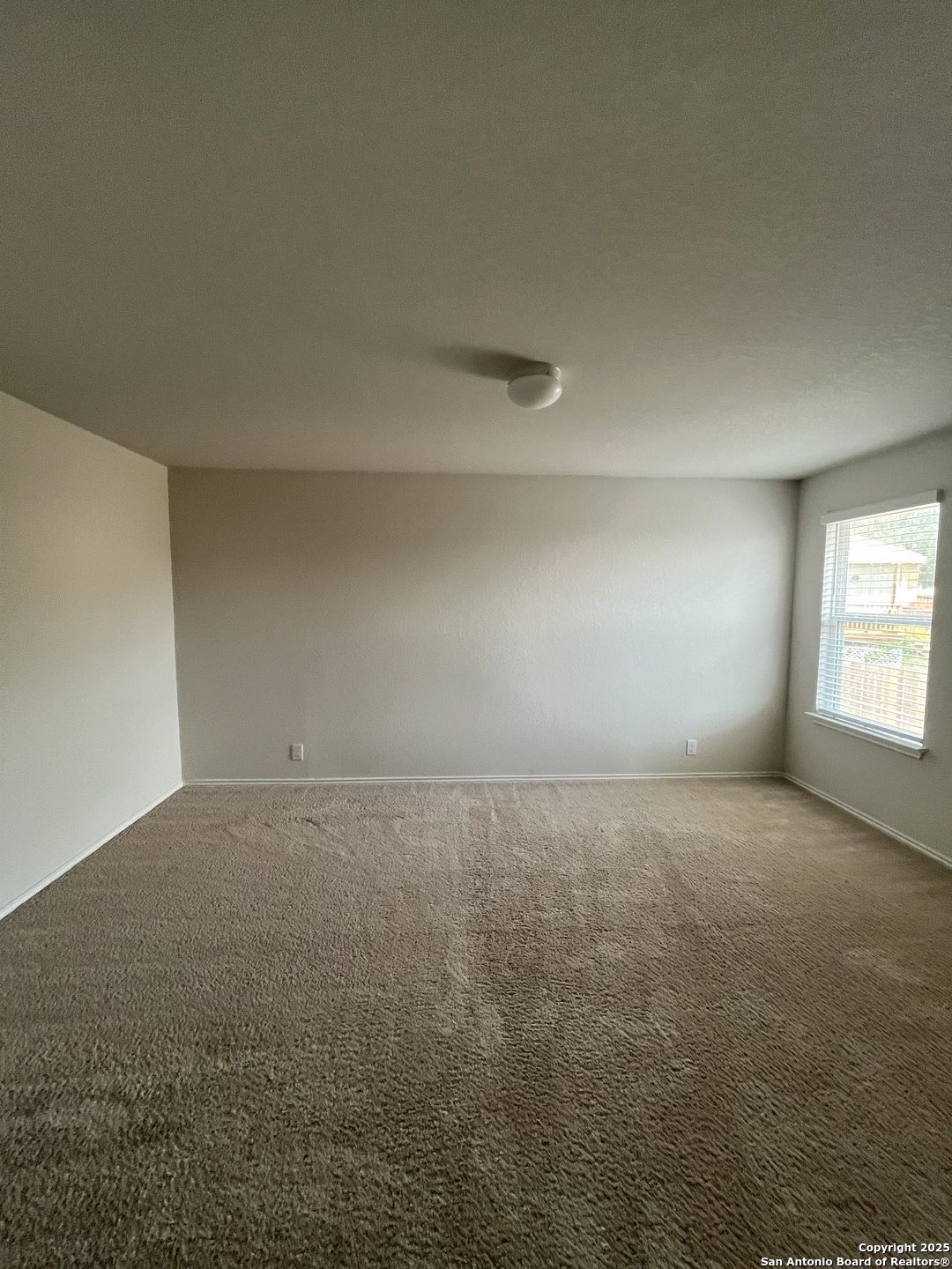 6218 Tadpole Bluff Converse, TX 78109 - Photo 15 of 23 a view of an empty room and a window