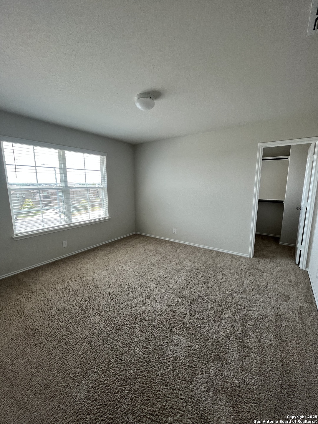 6218 Tadpole Bluff Converse, TX 78109 - Photo 18 of 23 an empty room with windows