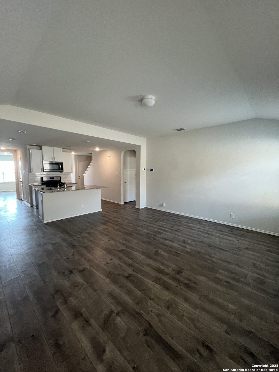 6218 Tadpole Bluff Converse, TX 78109 - Photo 6 of 23 a view of empty room with wooden floor and fireplace