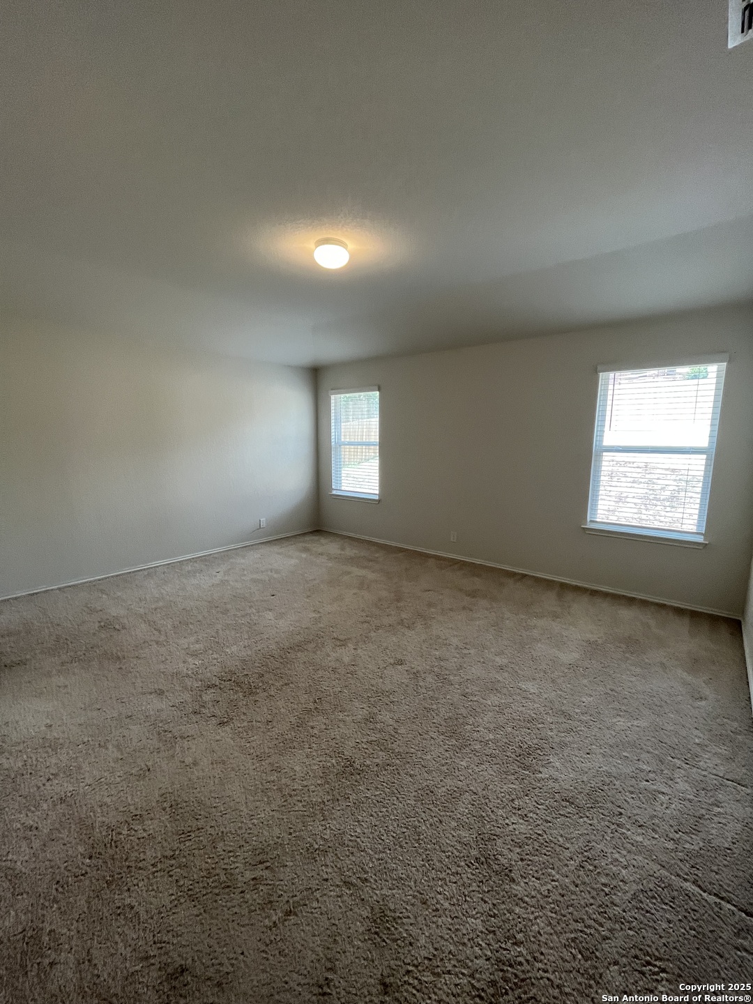 6218 Tadpole Bluff Converse, TX 78109 - Photo 10 of 23 an empty room with windows