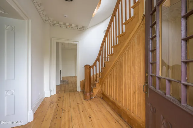a view of entryway with wooden floor
