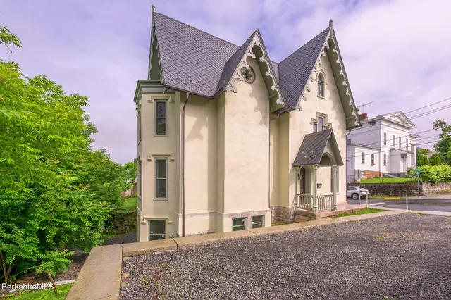 a view of a house with a street
