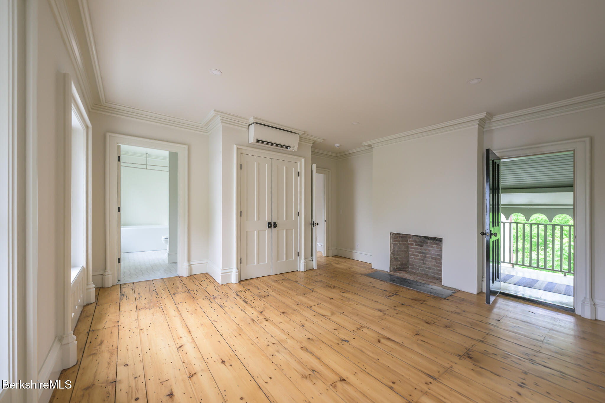 59 Allen Street Hudson, NY 12534 - Photo 39 of 59 a bedroom with a bed and wooden floor