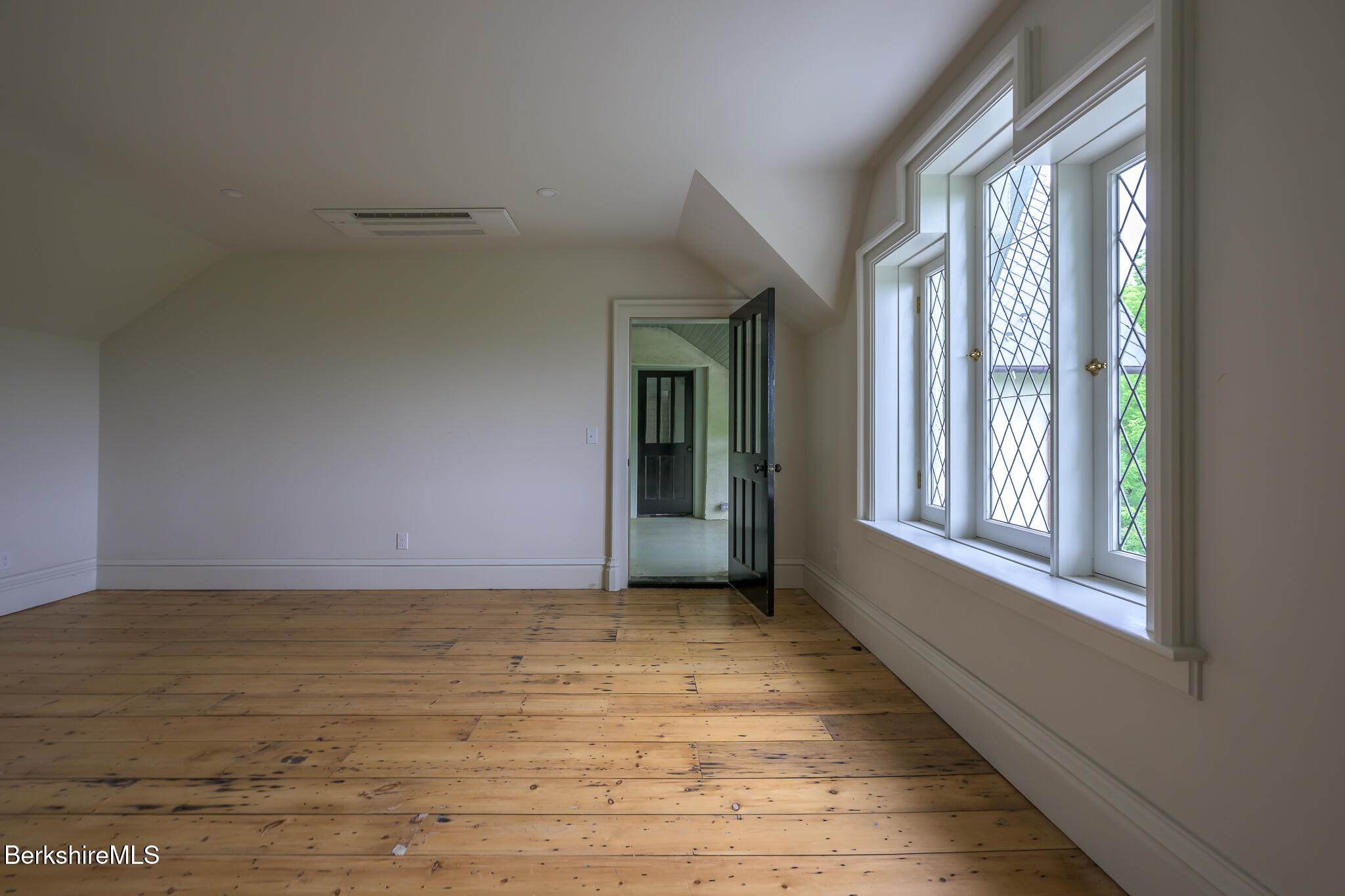 59 Allen Street Hudson, NY 12534 - Photo 41 of 59 a view of an empty room with wooden floor and a window