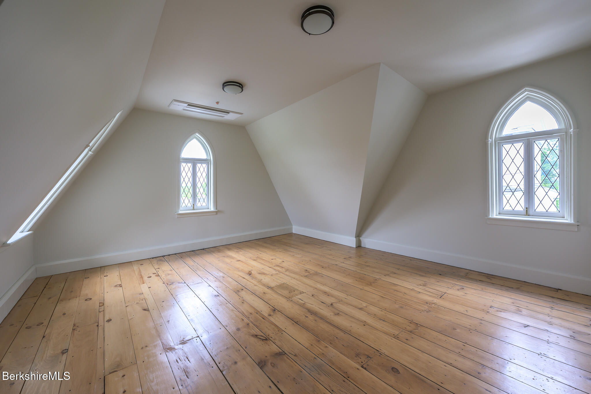 59 Allen Street Hudson, NY 12534 - Photo 51 of 59 an empty room with wooden floor and windows