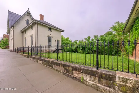 a view of a house with a street