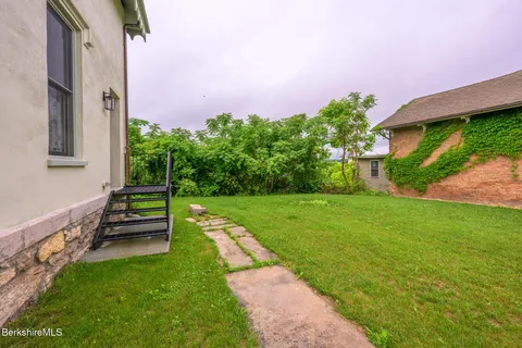 a view of a back yard with a house