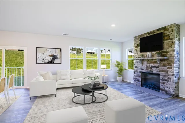 a living room with fireplace furniture and a flat screen tv