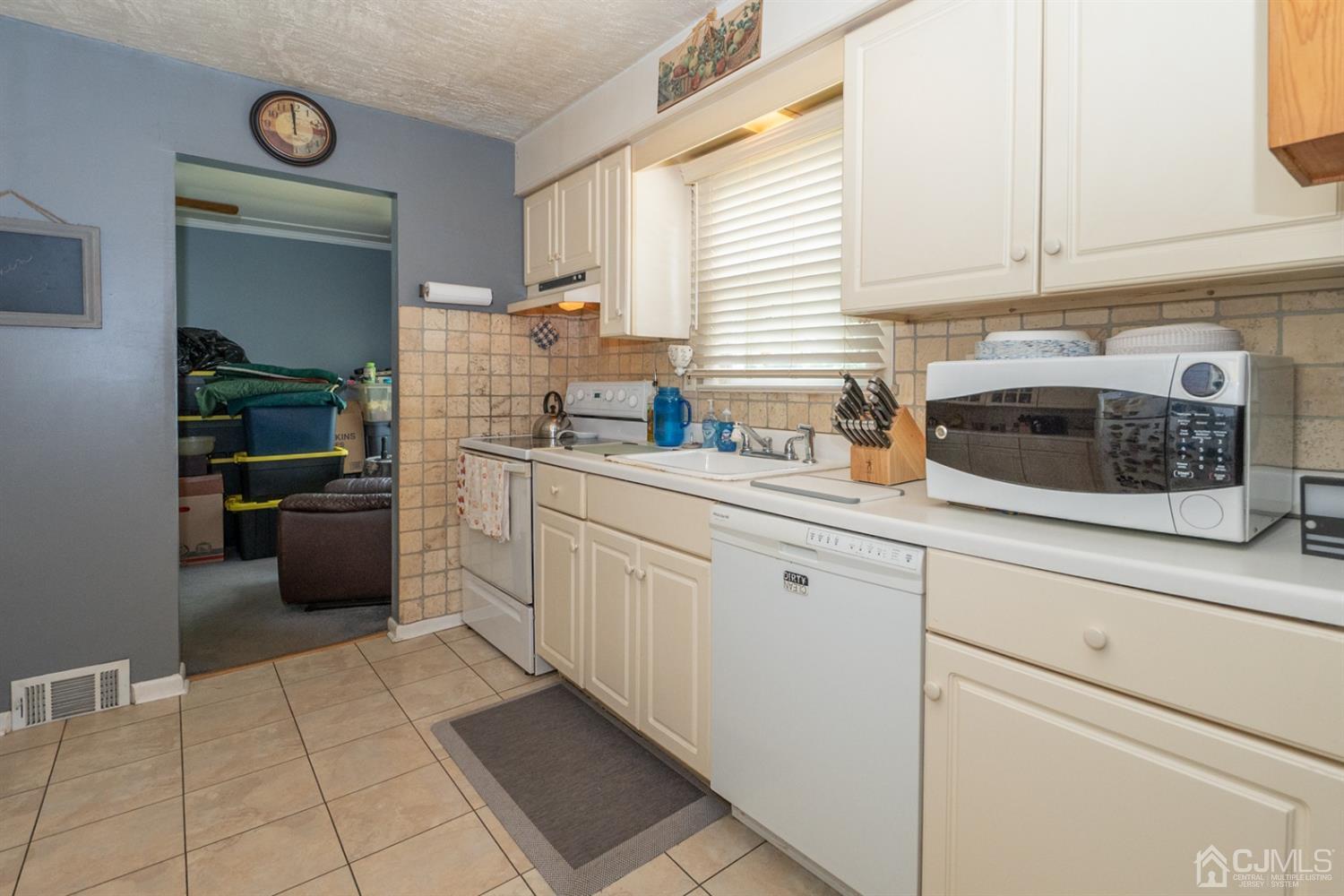 189 Texas Road Old Bridge, NJ 08857 - Photo 2 of 35 a kitchen with a cabinets and white appliances