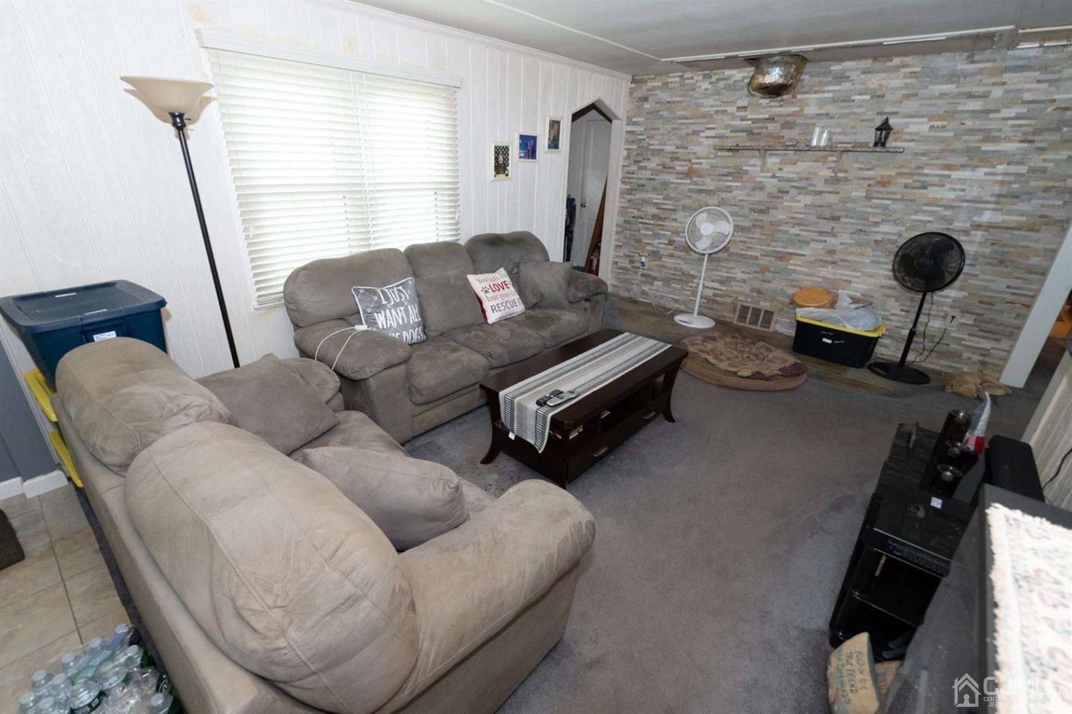 189 Texas Road Old Bridge, NJ 08857 - Photo 12 of 35 a living room with furniture and a fireplace