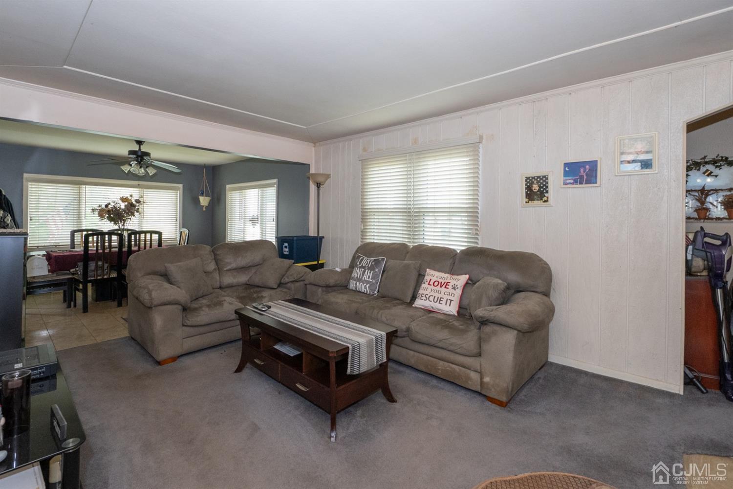 189 Texas Road Old Bridge, NJ 08857 - Photo 13 of 35 a living room with furniture and a dining table