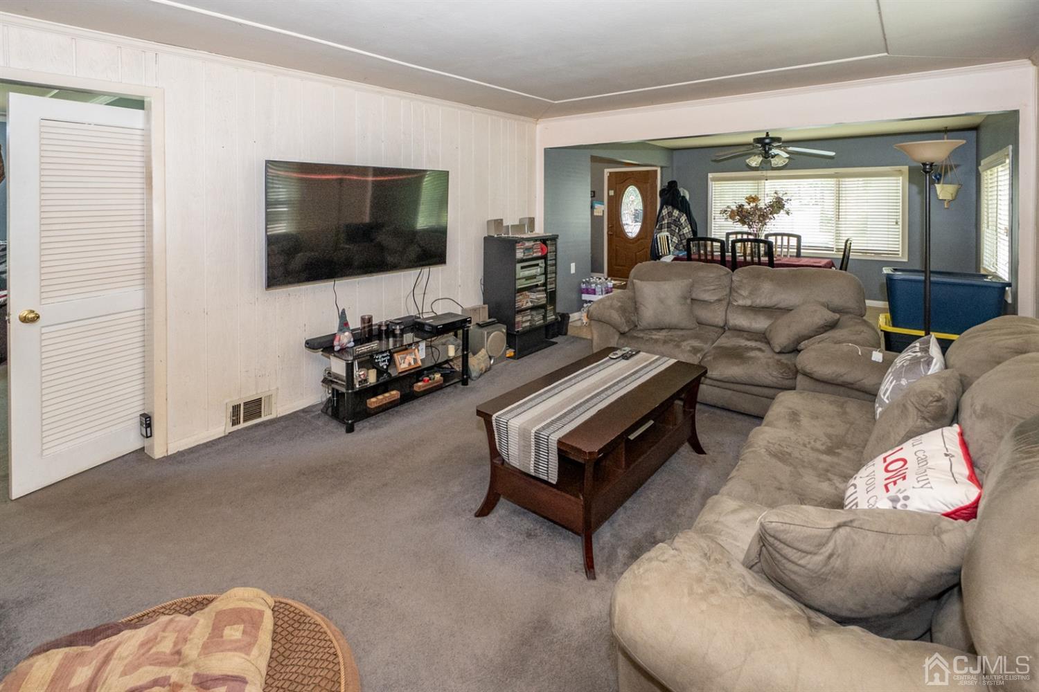 189 Texas Road Old Bridge, NJ 08857 - Photo 15 of 35 a living room with furniture and a flat screen tv