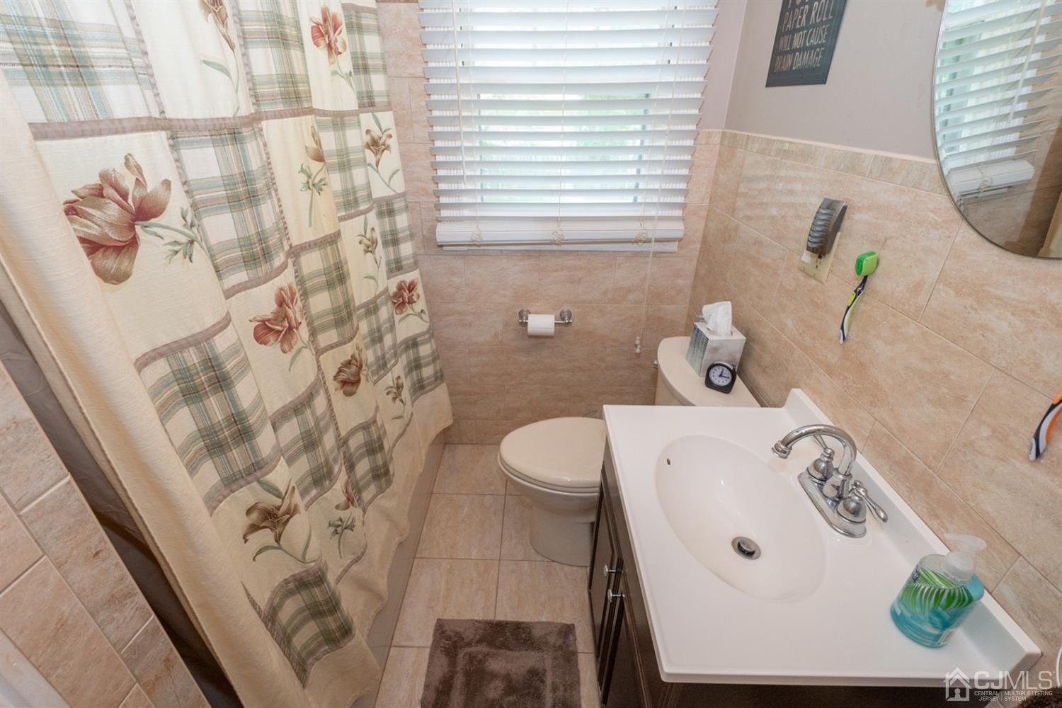189 Texas Road Old Bridge, NJ 08857 - Photo 19 of 35 a bathroom with a sink and toilet