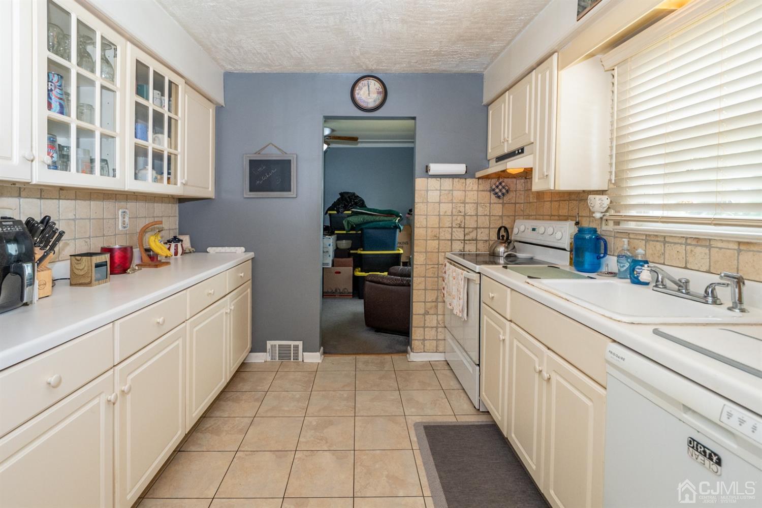 189 Texas Road Old Bridge, NJ 08857 - Photo 3 of 35 a kitchen with cabinets and window