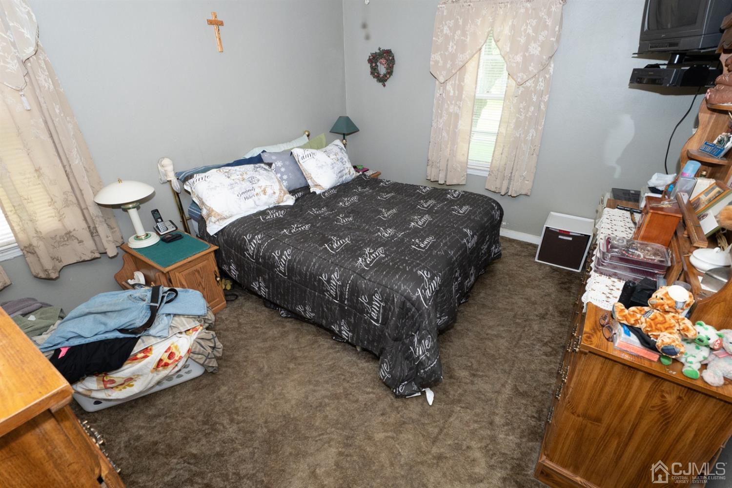 189 Texas Road Old Bridge, NJ 08857 - Photo 21 of 35 a bed sitting in a bedroom next to a window
