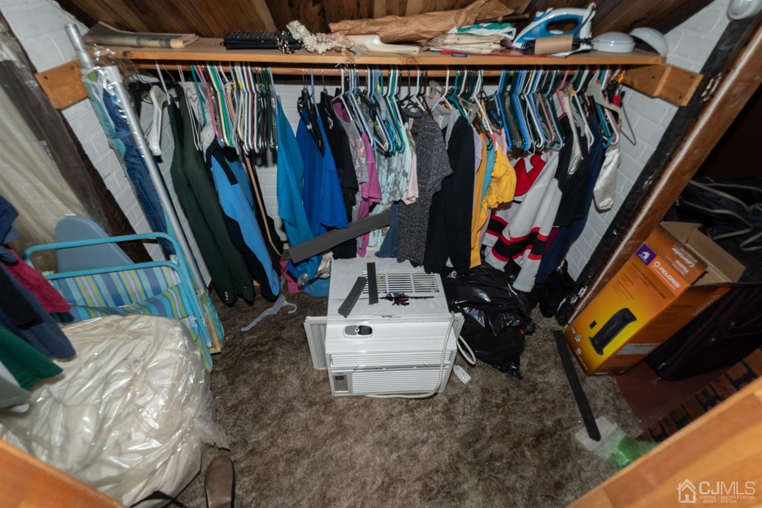 189 Texas Road Old Bridge, NJ 08857 - Photo 24 of 35 a view of walk in closet with clothes and shoes