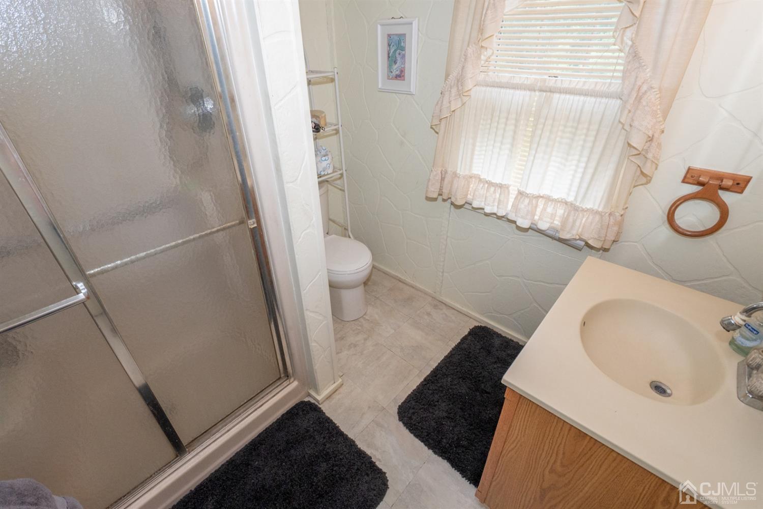 189 Texas Road Old Bridge, NJ 08857 - Photo 25 of 35 a bathroom with a sink and a mirror