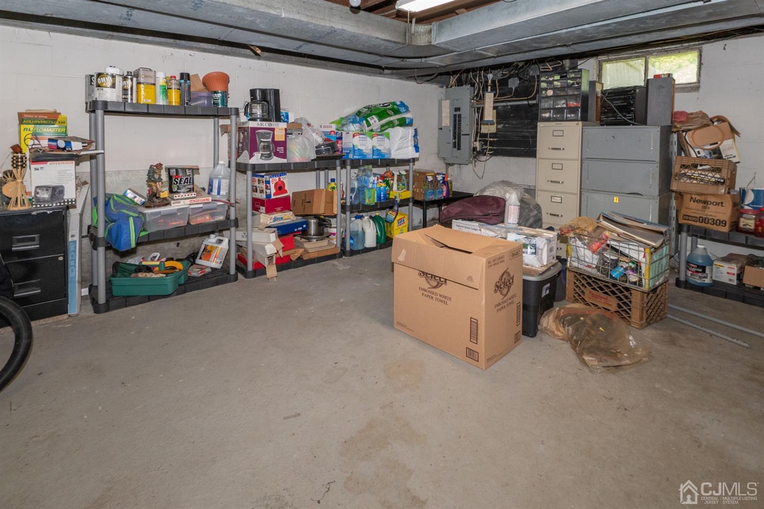189 Texas Road Old Bridge, NJ 08857 - Photo 29 of 35 a storage room with lots of clutter and cars