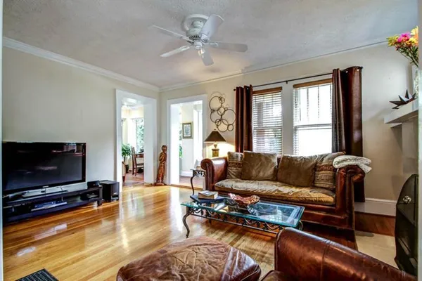 a living room with furniture and a flat screen tv