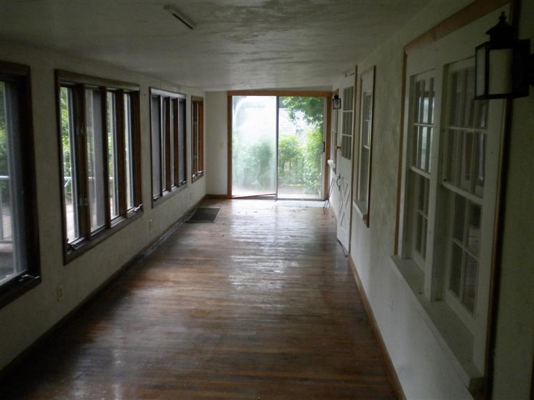 52 Telegraph Road Dennis Port, MA 02639 - Photo 5 of 13 a view of hallway with wooden floor