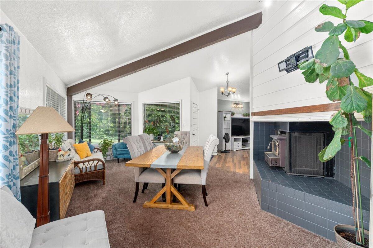 12325 Craig Avenue Red Bluff, CA 96080 - Photo 12 of 68 a living room with furniture a fireplace and a potted plant