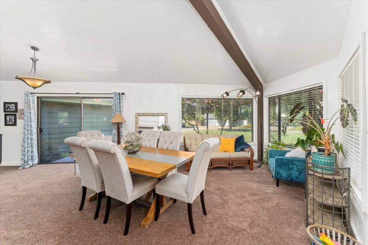 12325 Craig Avenue Red Bluff, CA 96080 - Photo 14 of 68 a dining room with furniture and a floor to ceiling window